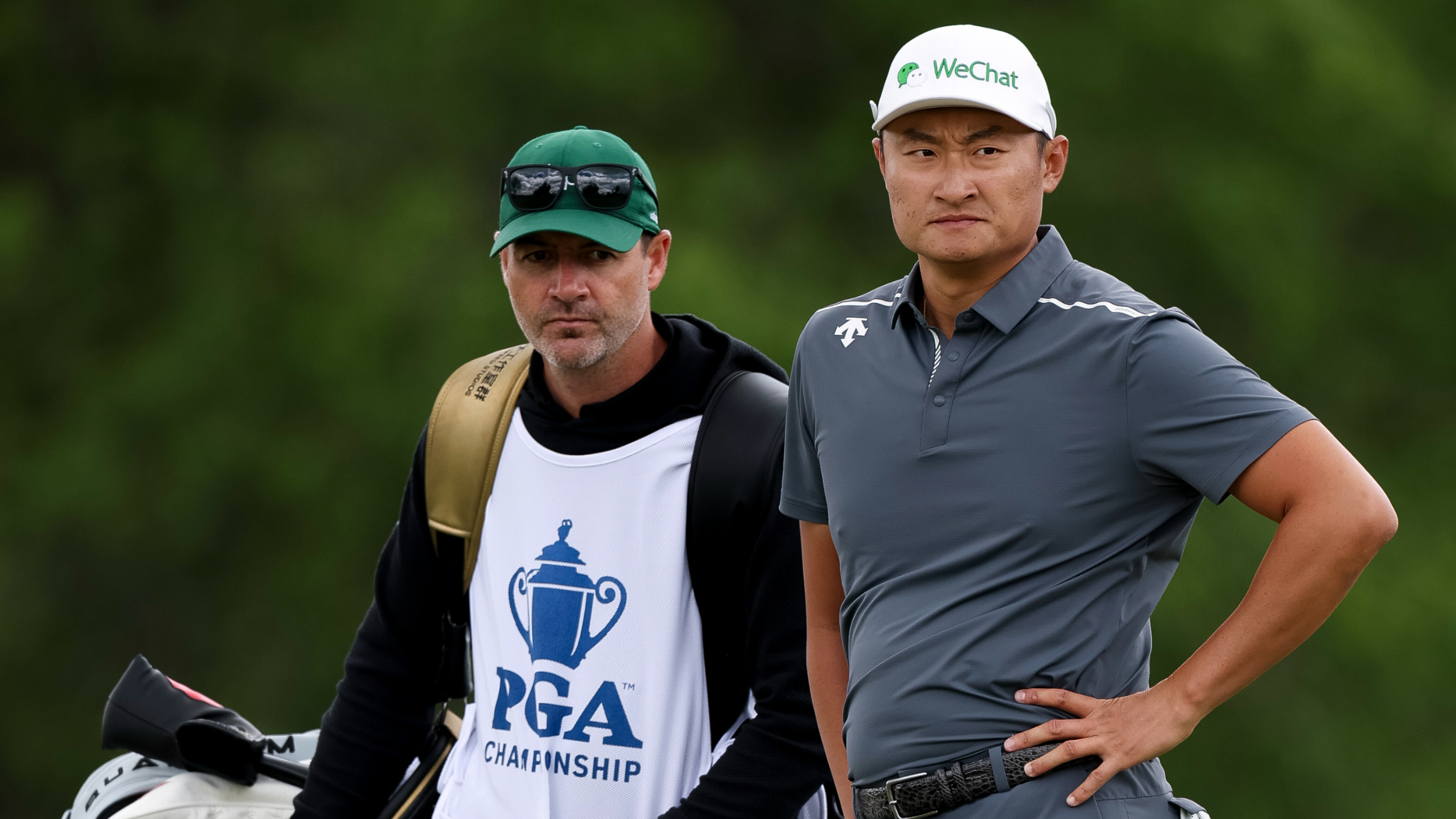 Haotong Li and his caddie