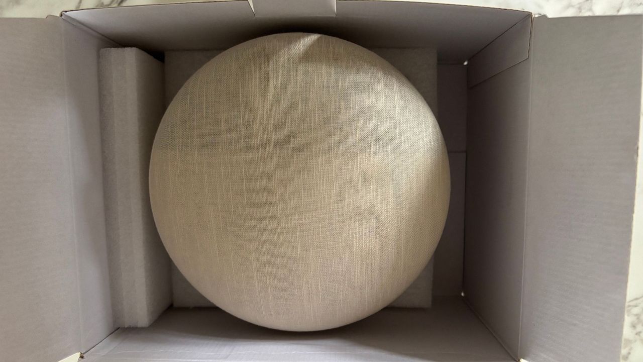 The Dreamegg Sunrise 2 alarm inside its open box during set-up