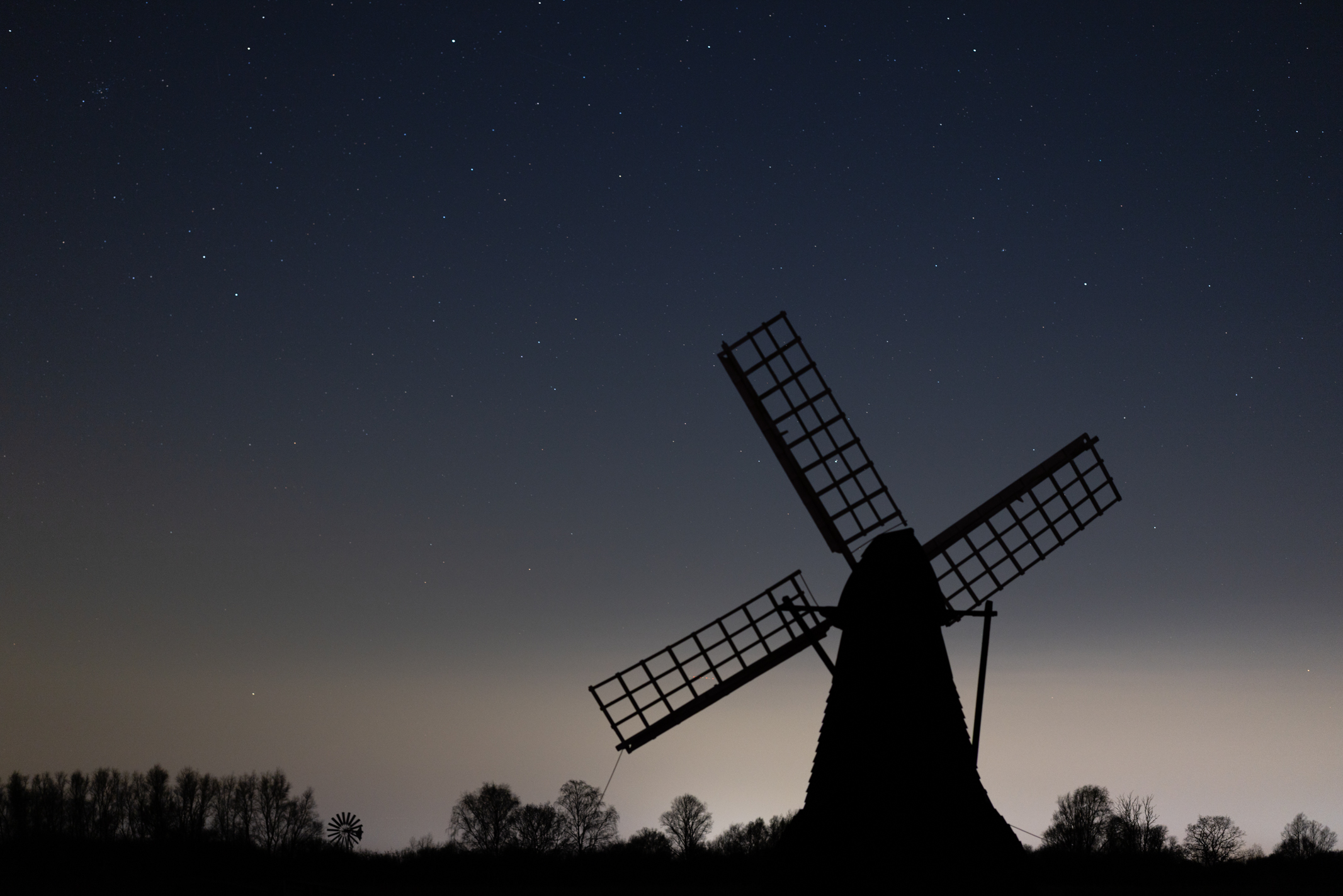 Photo of a windpump with the night sky behind taken with a Canon EOS R5 Mark II