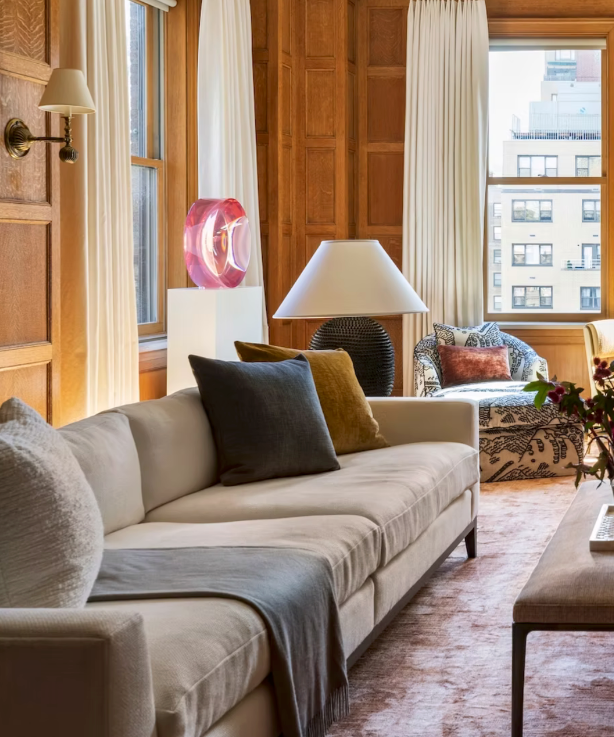 Wood panelled living room with extra deep cream sofa