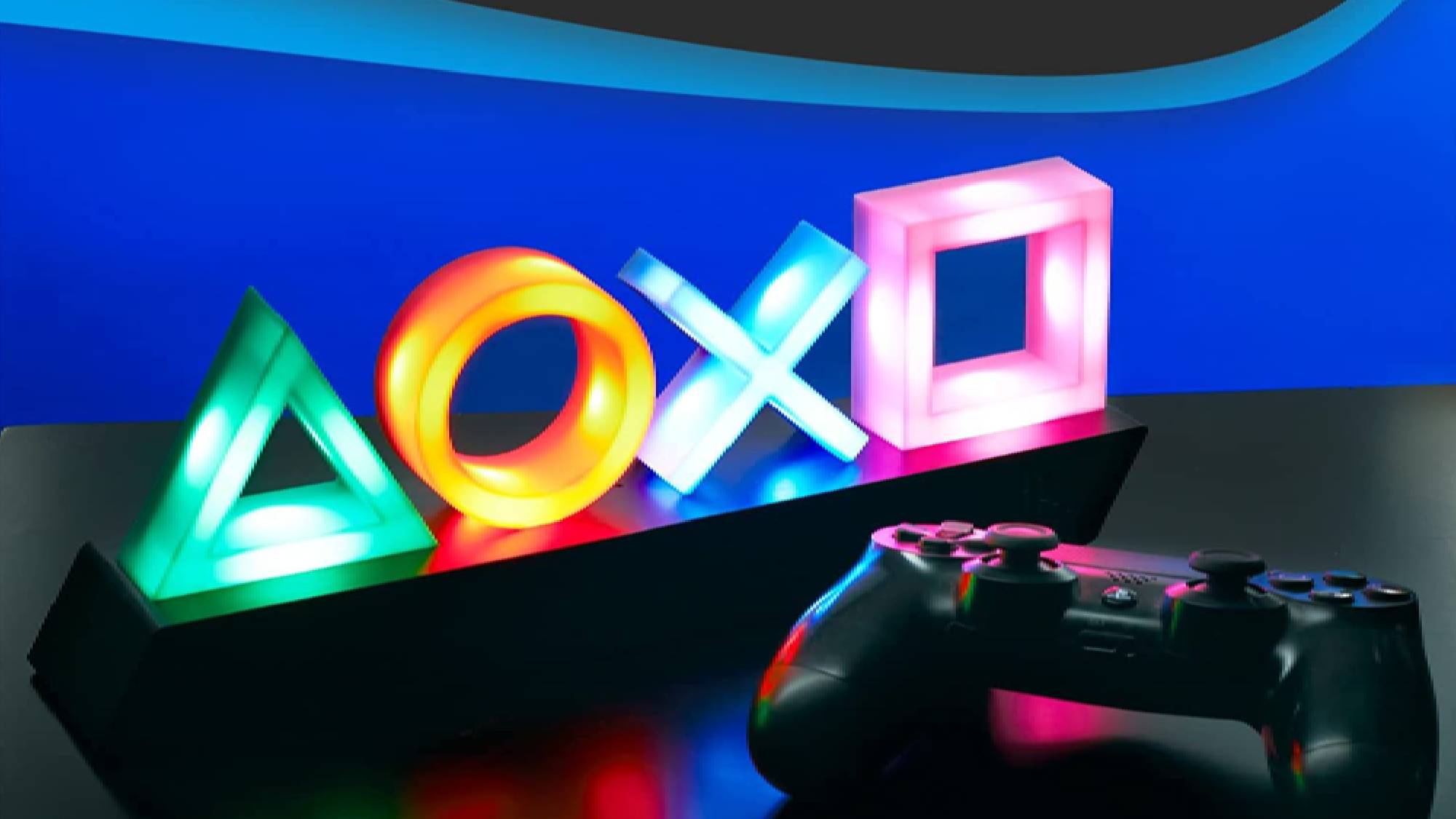 Paladone Playstation Icons Light next to a PlayStation controller