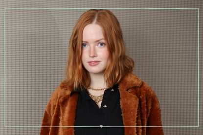 Actress Ellie Bamber posing for a photo