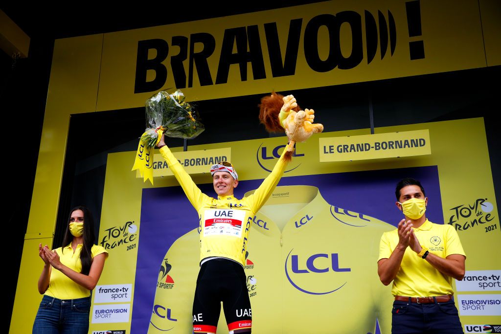 LE GRAND BORNAND FRANCE JULY 03 Tadej Pogaar of Slovenia and UAETeam Emirates Yellow Leader Jersey celebrates at podium during the 108th Tour de France 2021 Stage 8 a 1508km stage from Oyonnax to Le GrandBornand Lion Mascot LeTour TDF2021 on July 03 2021 in Le Grand Bornand France Photo by Chris GraythenGetty Images