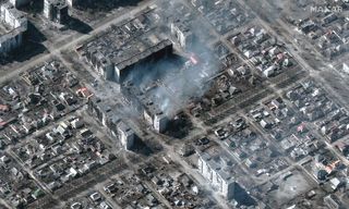 Maxar Technologies' Worldview-3 satellite captured this image of burning apartment buildings in the Ukrainian city of Mariupol on March 22, 2022.