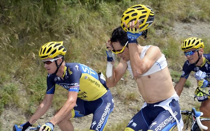 Alberto Contador (Saxo-Tinkoff) shows skill in removing his baselayer during the stage