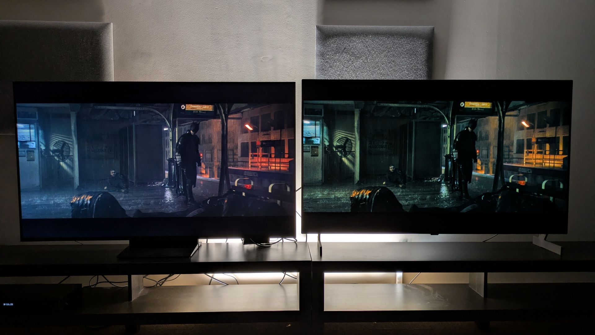 TCL C7L (left) vs LG B6E (right) with Batman stood in a subway platform from The Batman