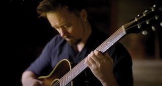 Jussi Reijonen plays fingerstyle on his vintage Gibson acoustic