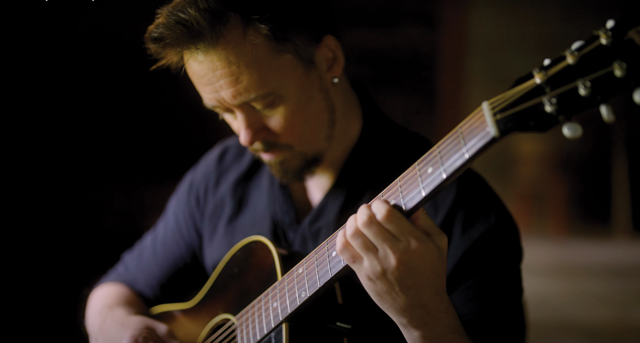 Jussi Reijonen plays fingerstyle on his vintage Gibson acoustic