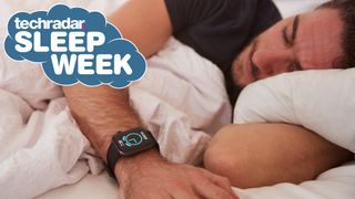 Man asleep wearing smartwatch in bed