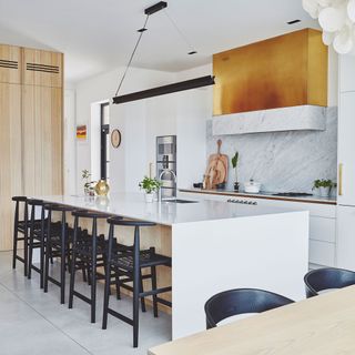 kitchen with white wall and marble worktop