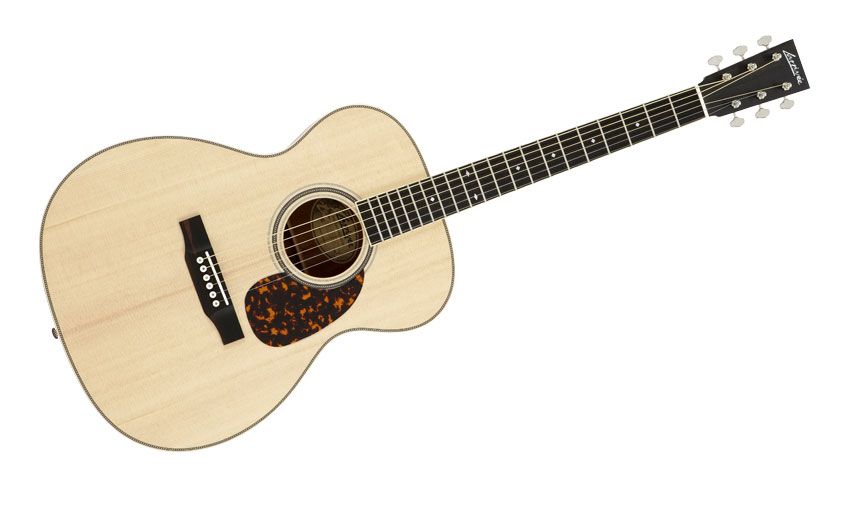 The OM's spruce top is reddish in hue and has some longitudinal striping