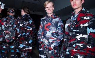 Male models in blue, grey, white and red camo outfits