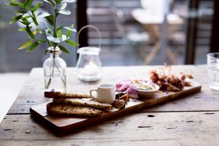 A charcuterie board on a wooden table.