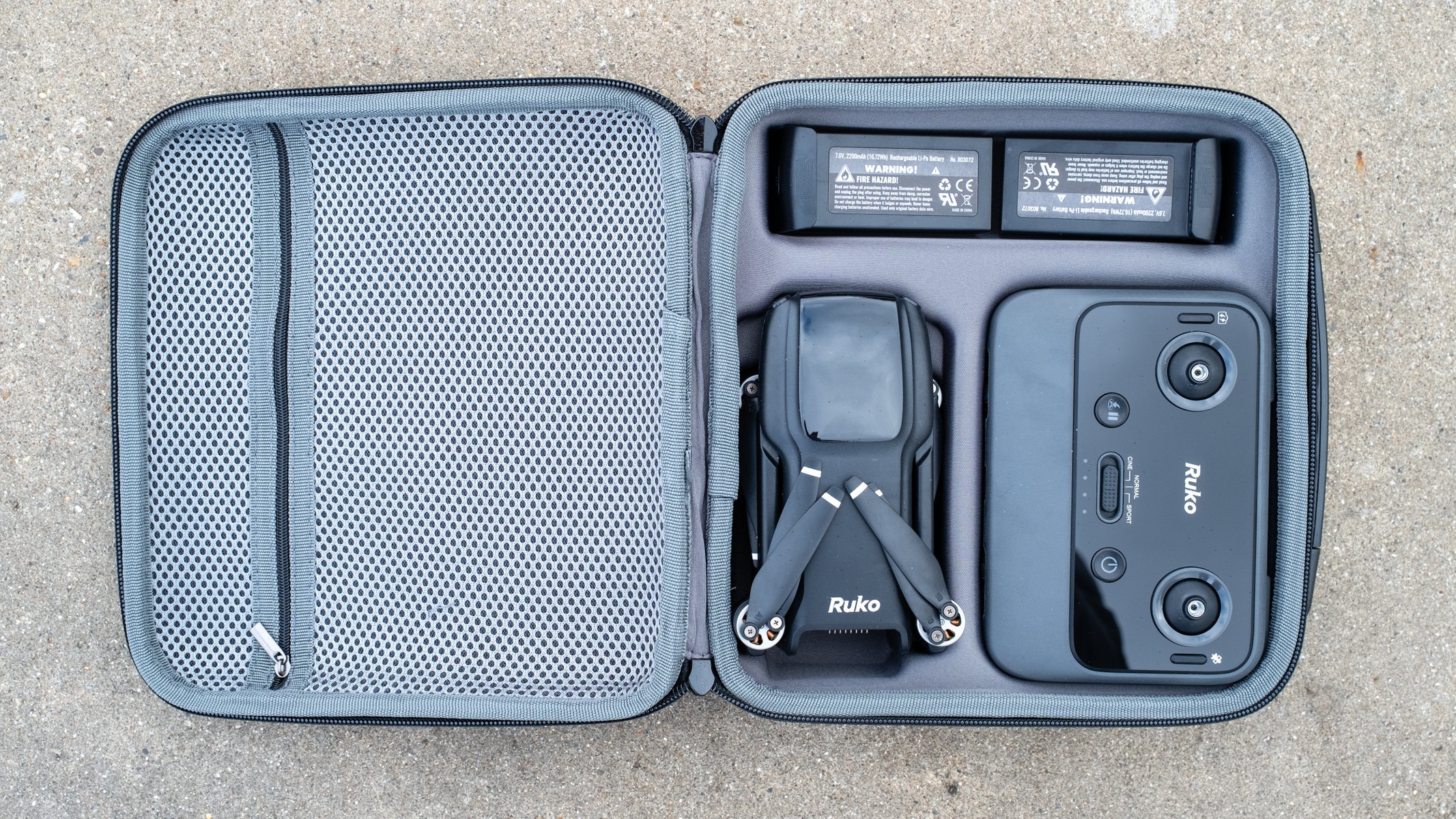 Ruko U11MINI drone open case showing full kit.