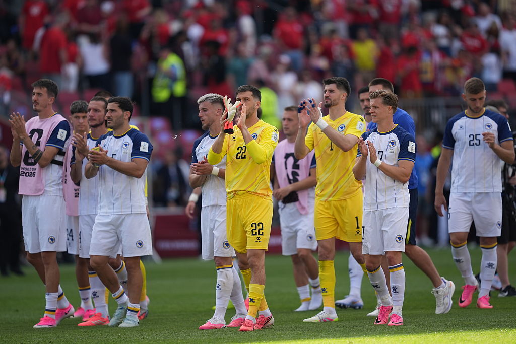 The Bosnian team clapping the fans after their match against Canada in the World Cup.