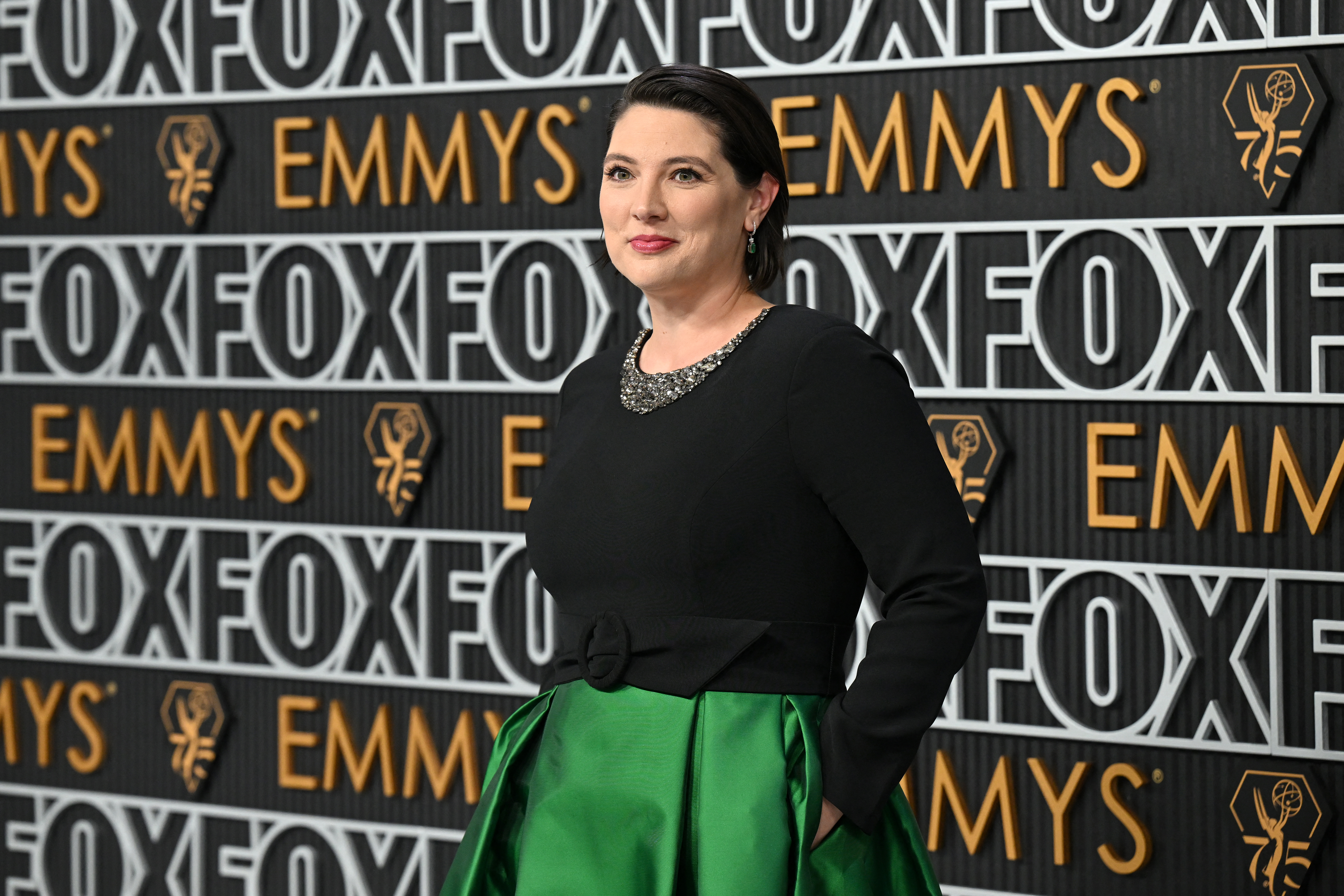 taylor Jenkins Reid wearings a black and green dress on the red carpet for the 75th Emmy Awards at the Peacock Theatre at L.A. Live in Los Angeles on January 15, 2024