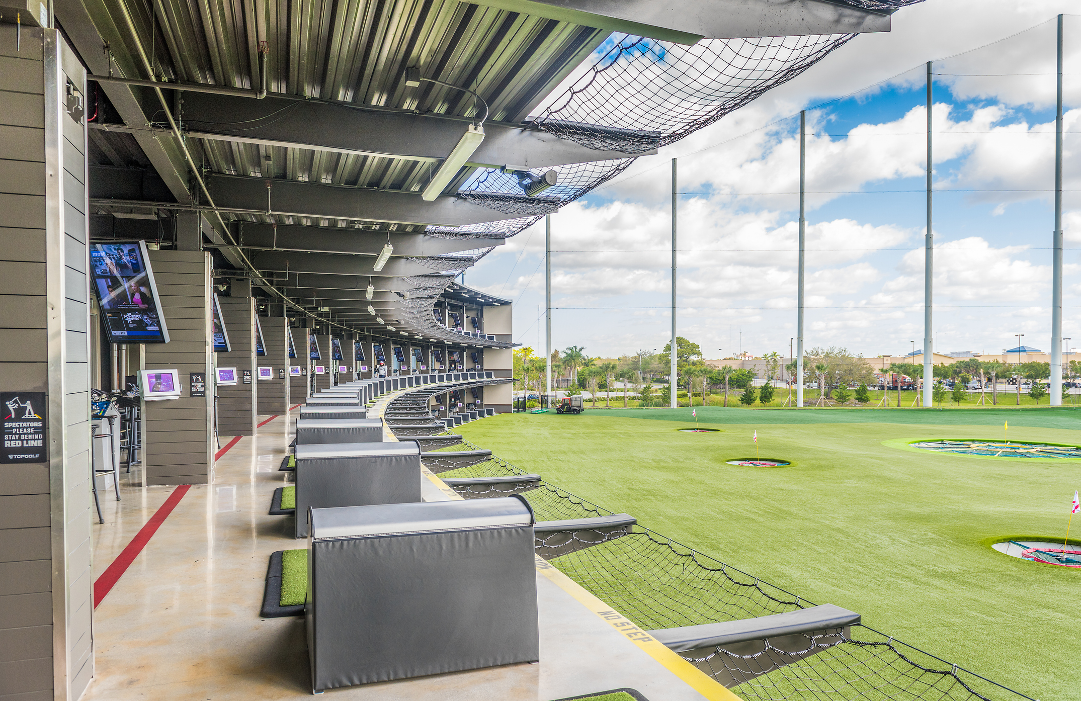 A modern driving range with three tiers