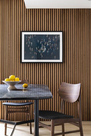 how to make a tiny apartment feel bigger with vertical panelling by Interior Fox