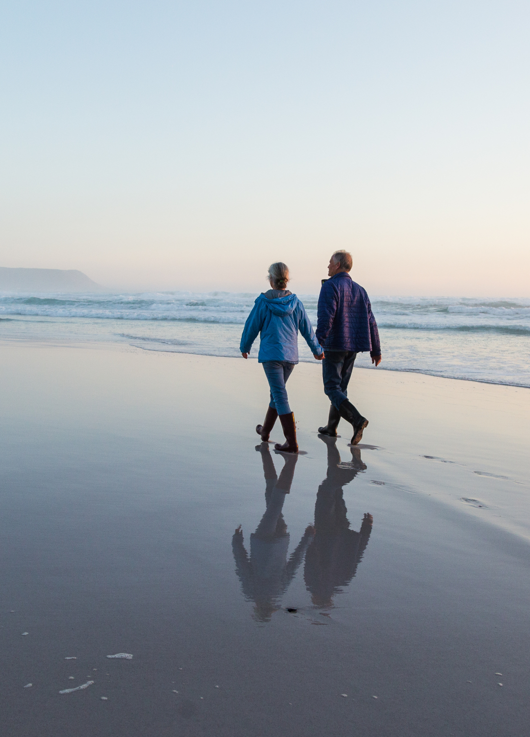 Couple walking along the beach