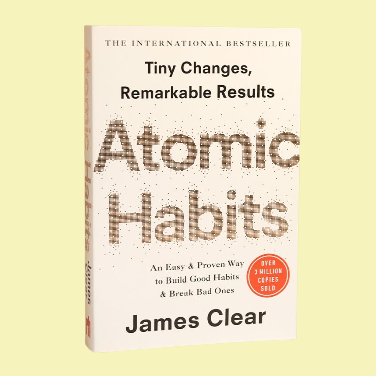 A paperback book titled &#039;Atomic Habits&#039;