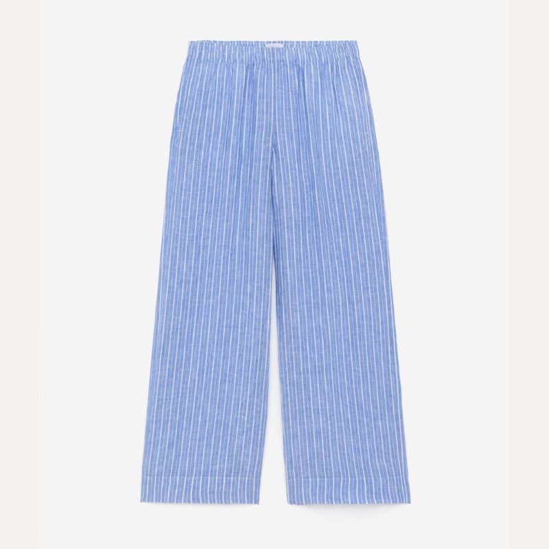 A cutout of blue and white stripe Arket linen trousers
