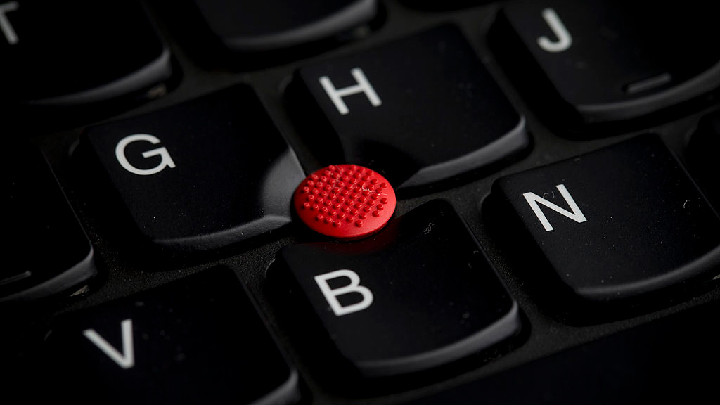 A macro shot of a trackpad button or 'nub' on the keyboard of a Lenovo ThinkPad T440s laptop.