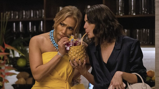Jennifer Lopez and Callie Hernandez sharing a drink in Shotgun Wedding