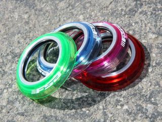 Originally aimed at BMX, FSA's optional polycarbonate caps can be subbed into many of their road and mountain bike headsets to add a splash of color.