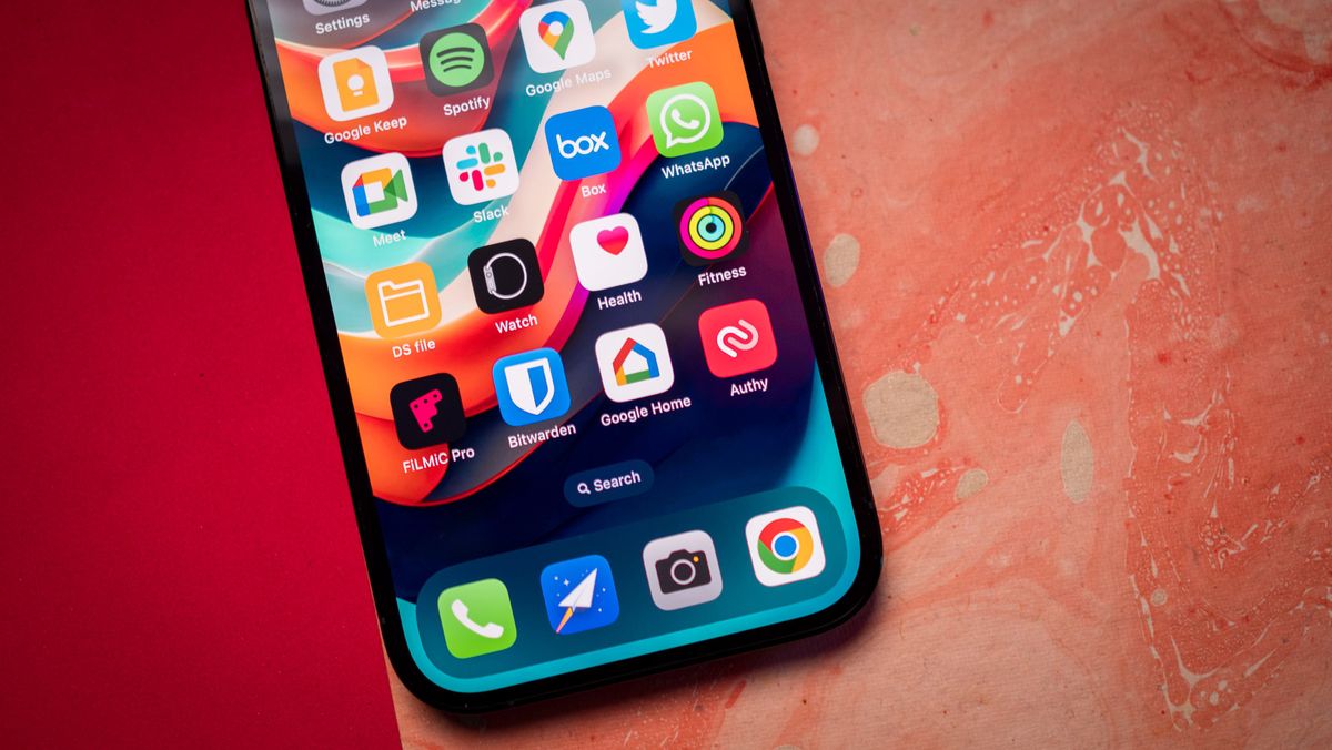iPhone 14 Pro lower half of screen against red background