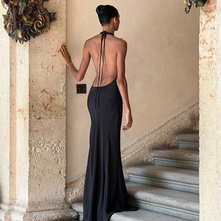 Dana Nozime wearing a black backless gown.