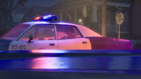 Michael Myers sits in the back of a police car after being detained in Halloween the Game