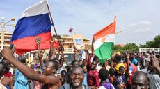 crowd in niger waving russian flags in support of military coup
