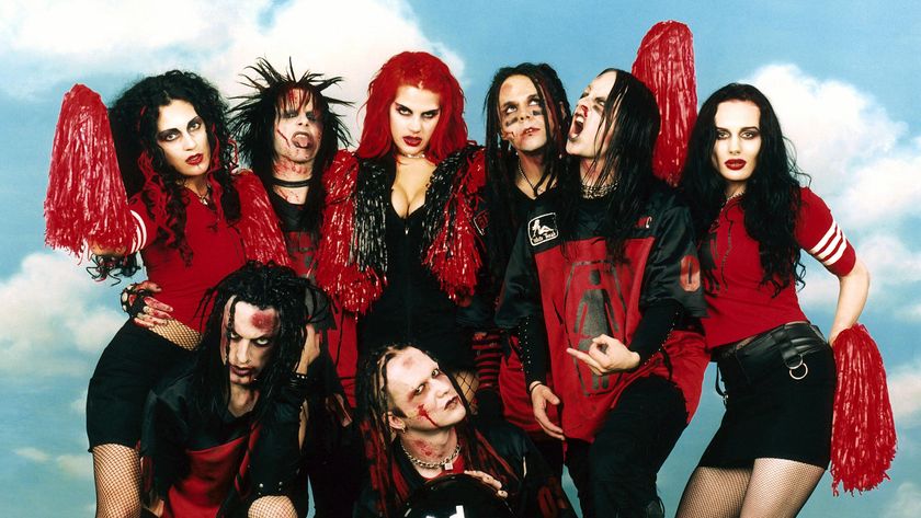 Murderdolls posing with zombie cheerleaders in 2003