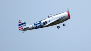 Model plane with American insignia in flight