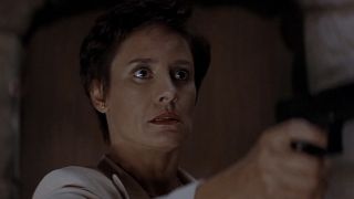 Laurie Metcalf holding a gun in Scream 2