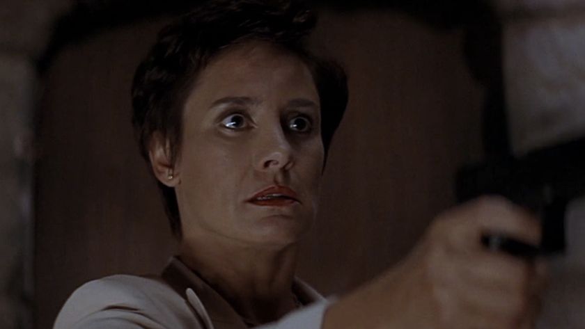 Laurie Metcalf holding a gun in Scream 2