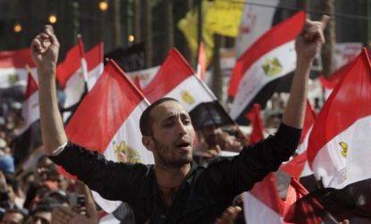 A protester chants in Tahrir square
