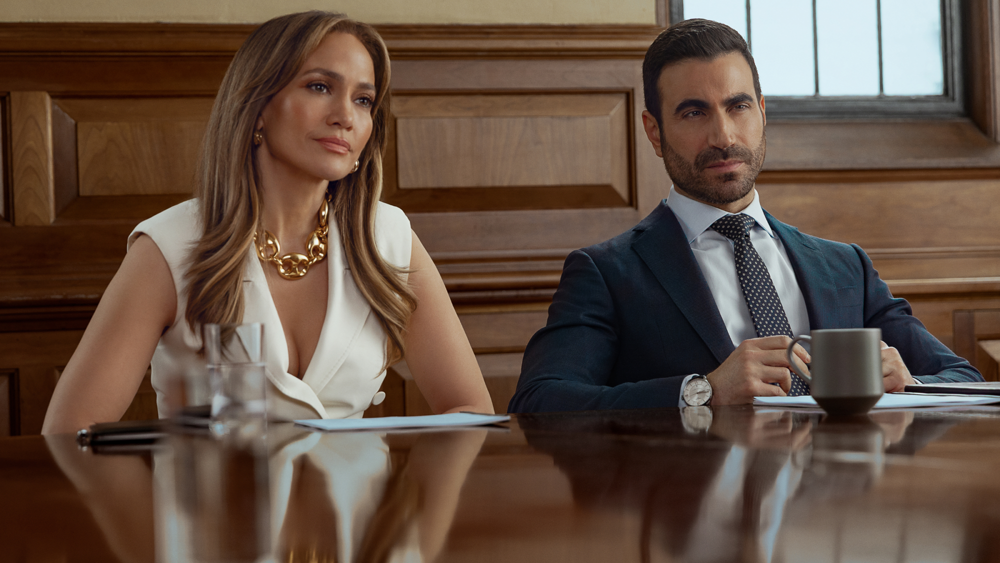 (L-R) Jennifer Lopez as Jackie Cruz and Brett Goldstein as Daniel Blanchflower in Office Romance.