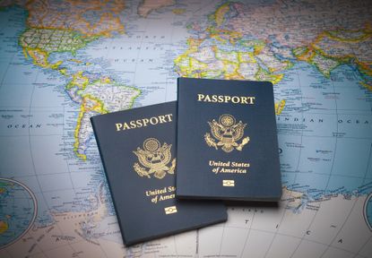 US passports on a world map background