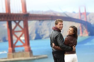 Young couple at Golden Gate Bridge.