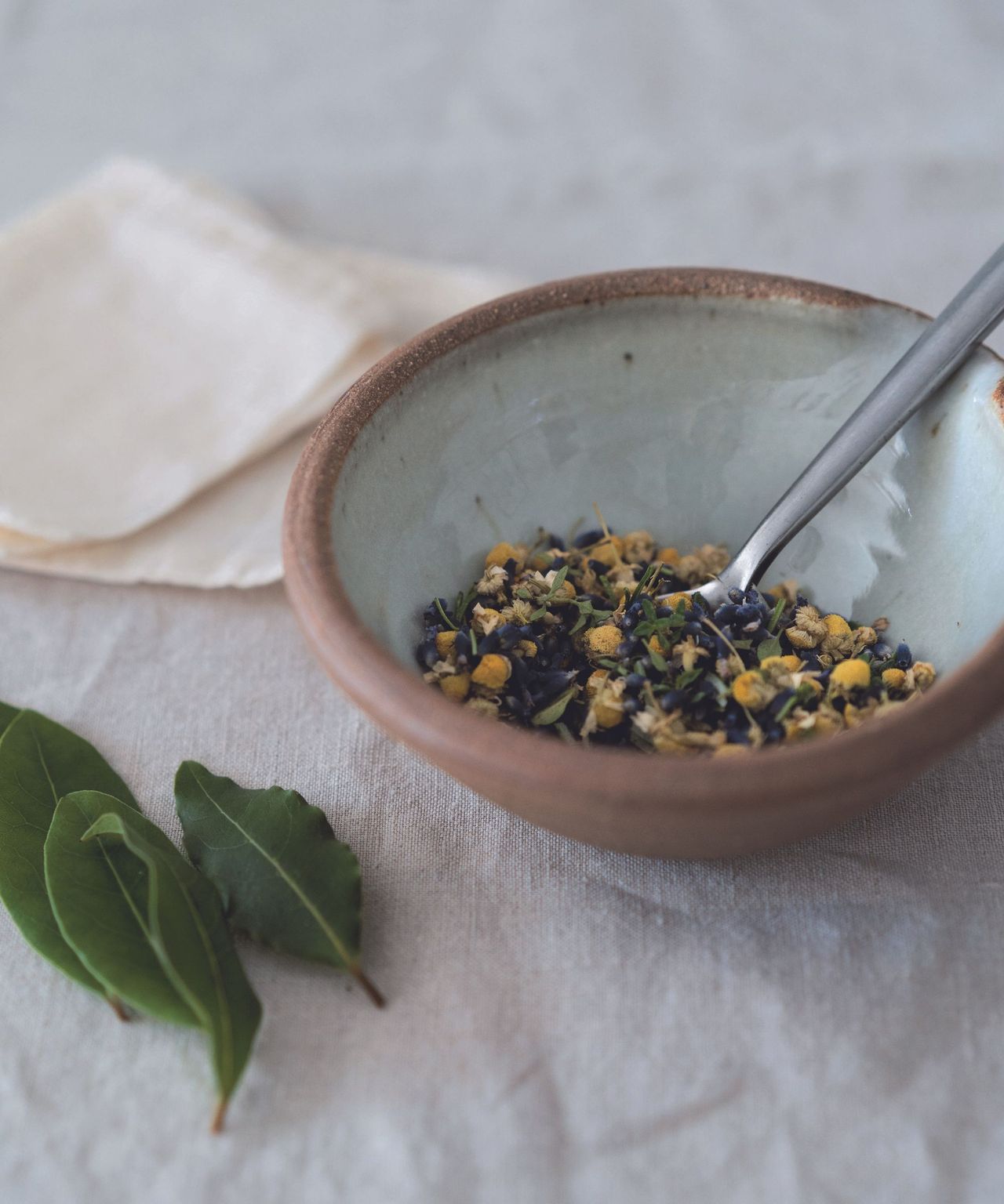 Bowl full of herbs and flowers, bags