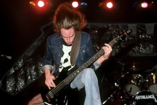 Cliff Burton performs onstage with Metallica at the Royal Oak Music Theatre in Royal Oak, Michigan on February 1, 1985