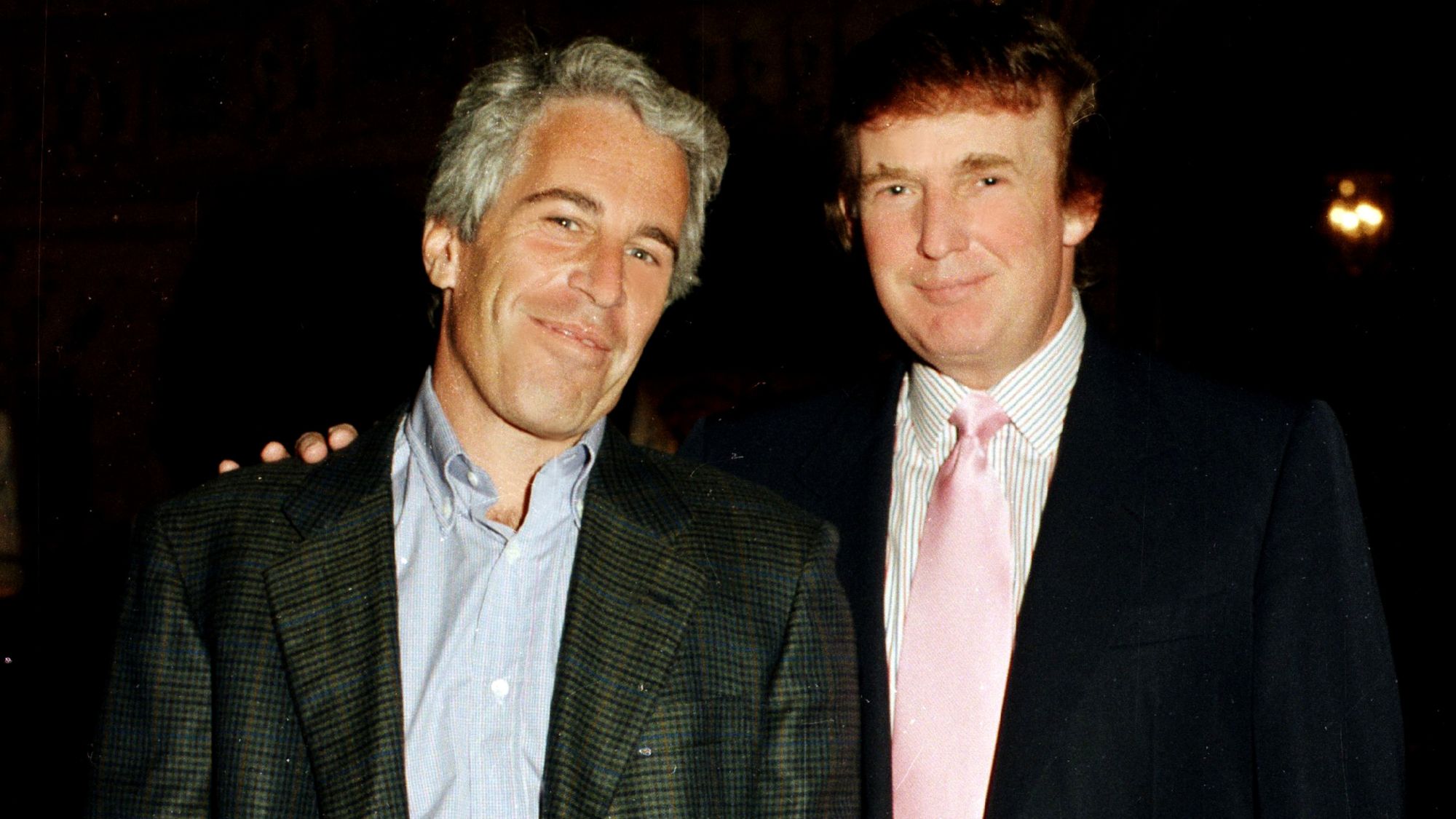 Portrait of American financier Jeffrey Epstein (left) and real estate developer Donald Trump as they pose together at the Mar-a-Lago estate, Palm Beach, Florida on February 22, 1997. (Photo by Davidoff Studios/Getty Images)