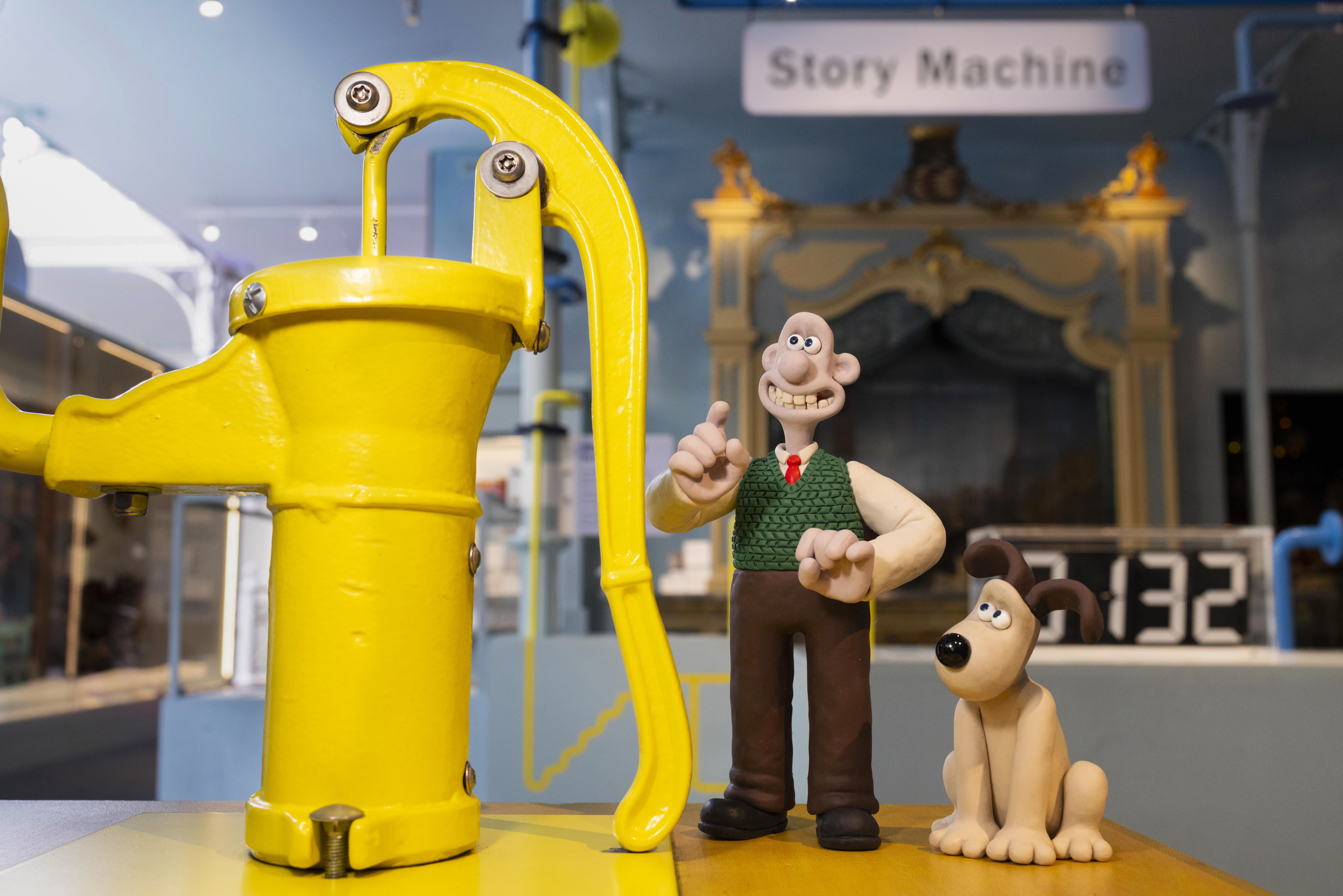 claymation wallace and gromit in front of an old yellow pump inside one of the v&amp;amp;a&#039;s exhibitions