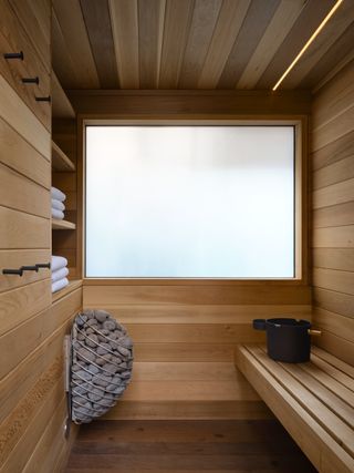 A wooden home sauna with frosted window