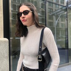 best bras, a close up photo of an editor wearing a white turtleneck top with a no-show bra