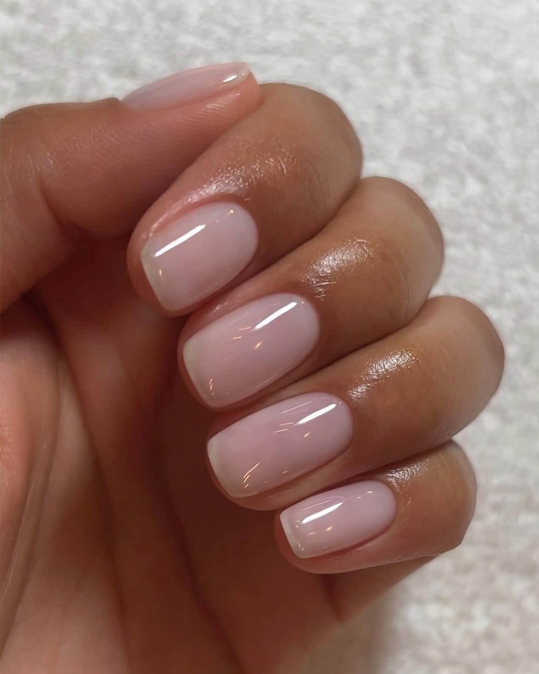 Sheer pink neutral nail color.