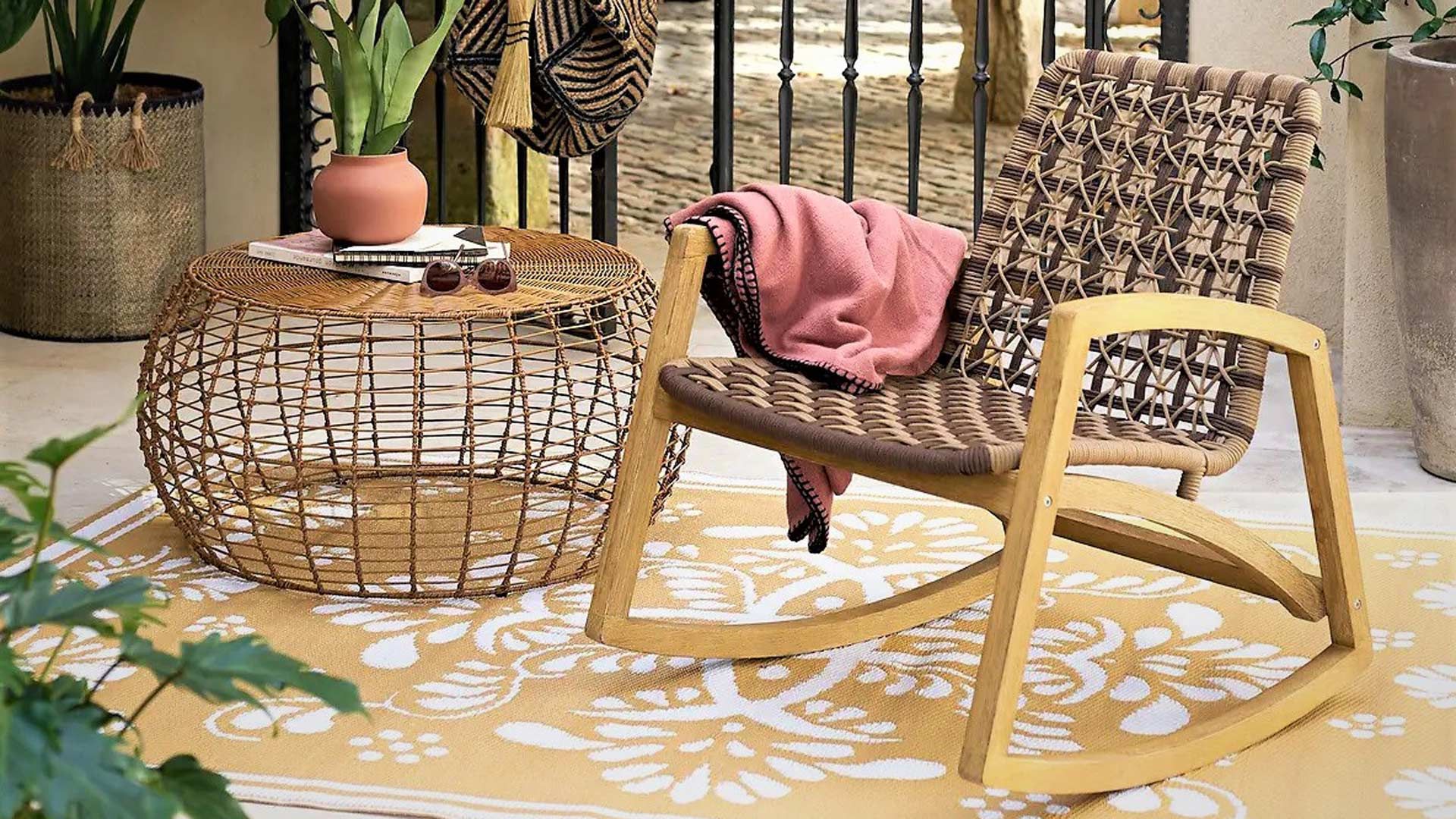 outdoor living room with outdoor rocking chair and coffee table