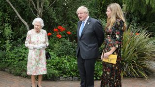 Queen Elizabeth and British Prime Minister Boris Johnson and wife Carrie Johnson arrive for a drinks reception