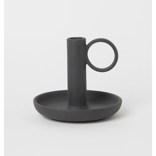 black stoneware candle holder with a dish and handle design